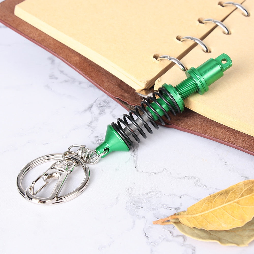 Adjustable shock absorber keychain